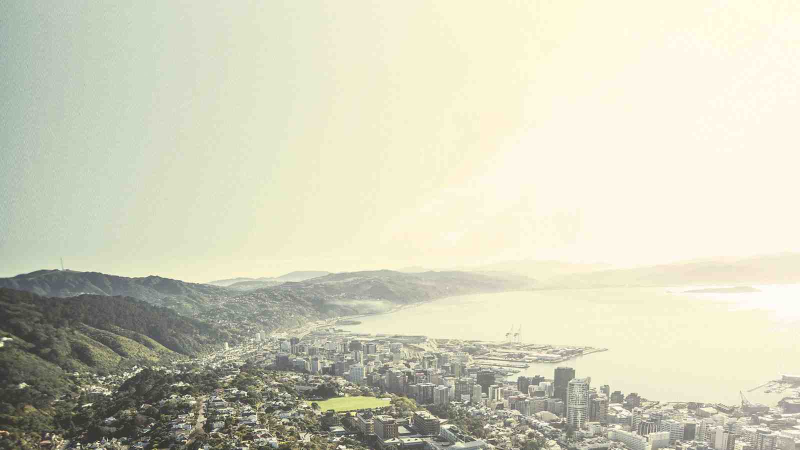 A wide shot of Wellington harbour with Wellington city in the foreground.