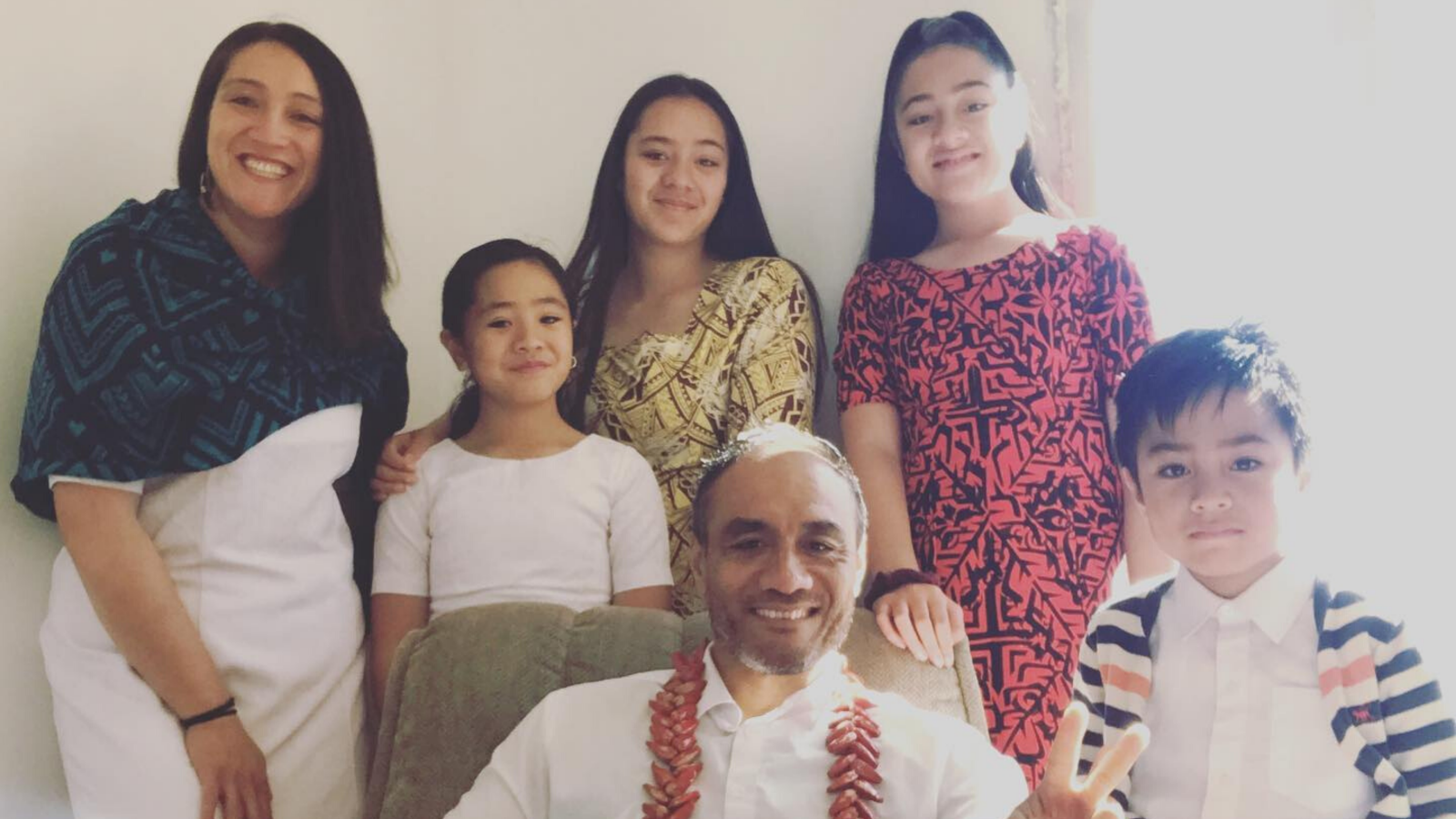 The Muaiava family, Sadat seated in chair.