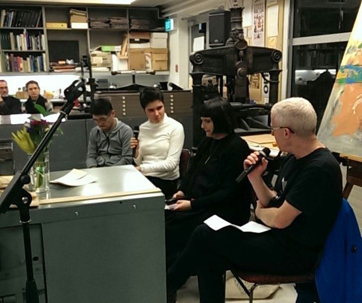 Creators-in-residence seated in semi-circle in discussion.