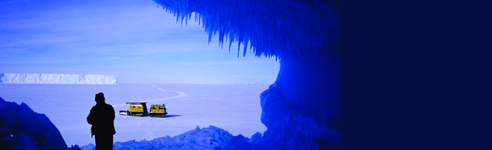 Looking out of an ice berg cave with a haglund in the distance.