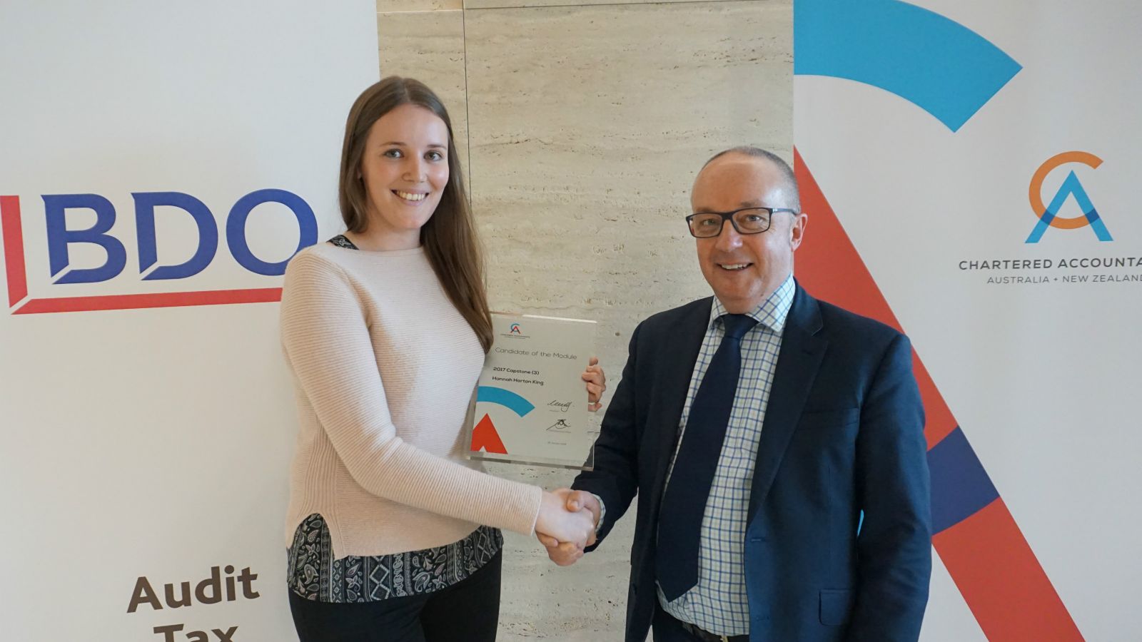 Peter Vial, New Zealand Country Head of CA ANZ, congratulates Hannah Horton for Australasian-topping effort in the Capstone Module exams.
