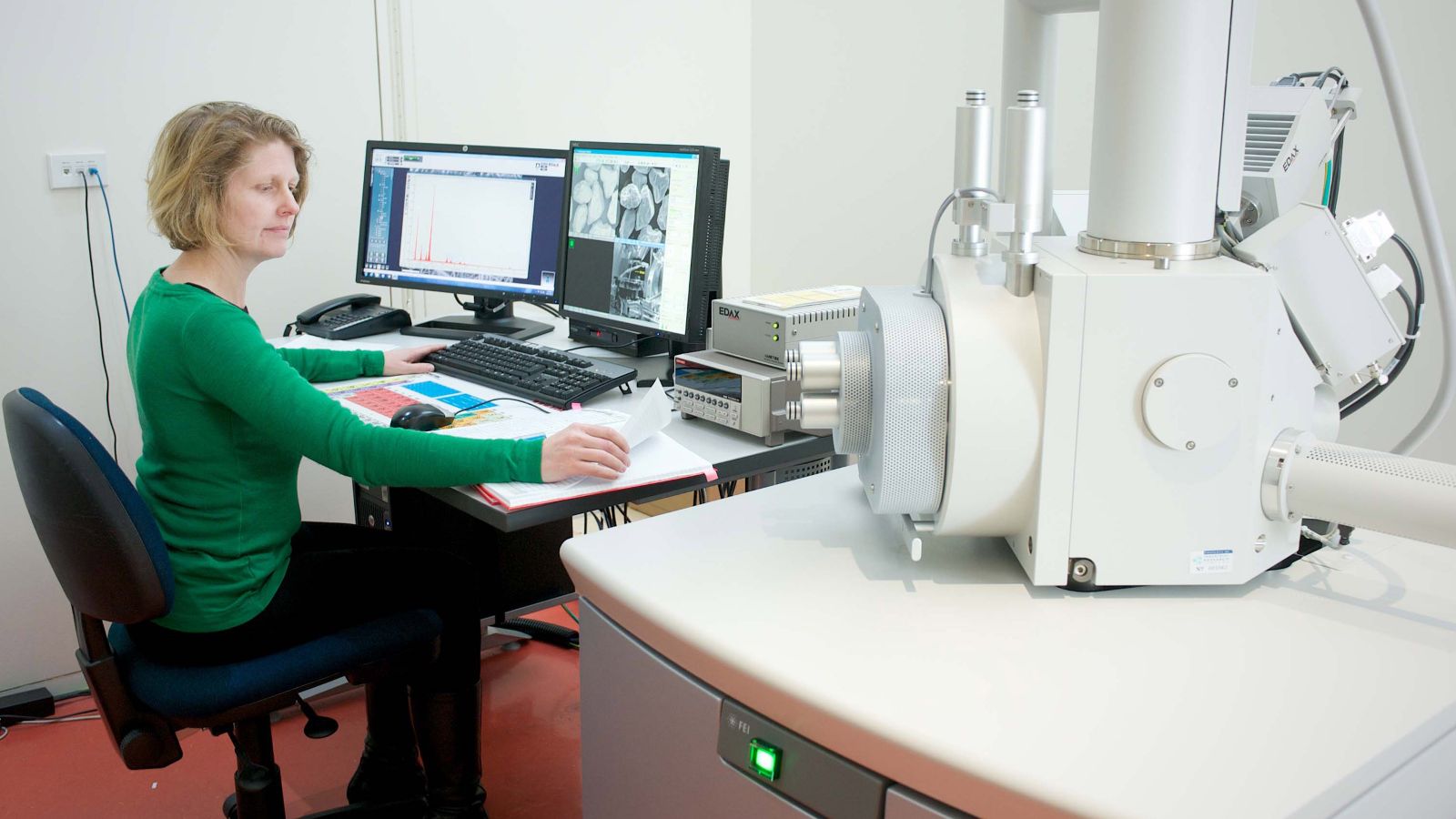 Photograph of an electron microscope in use.
