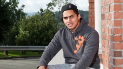 Āwhina mentor Stephen Leitupo sitting outside a building.