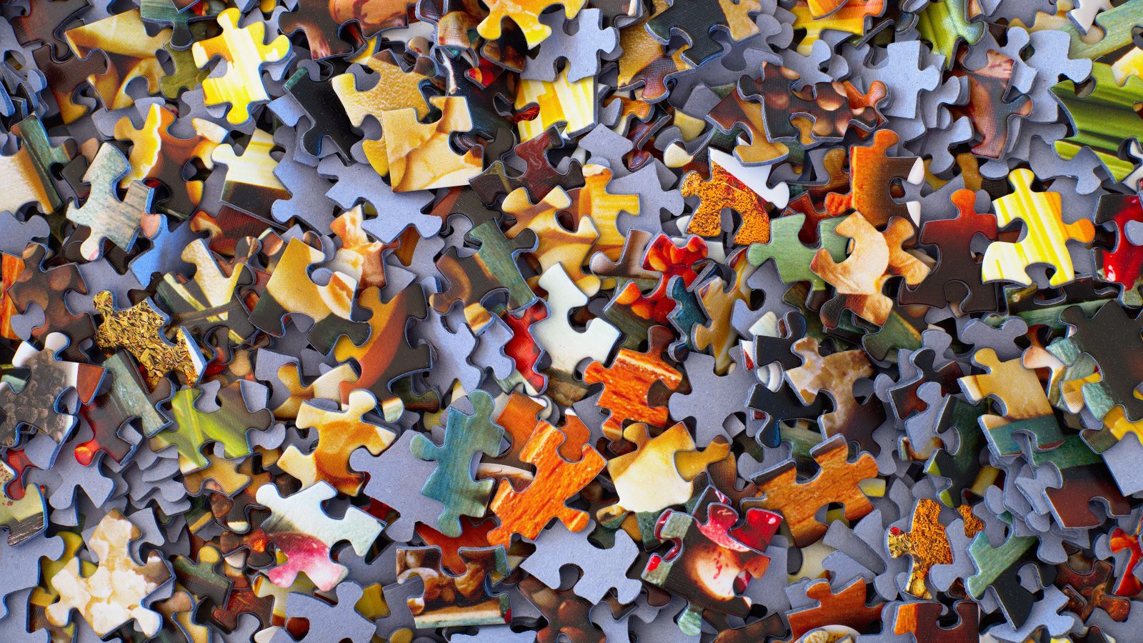 a jumble of jigsaw puzzle pieces