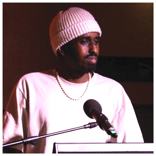 Portrait of Liban Ali wearing a pink patterned turban in the Hub