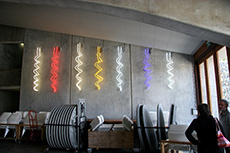 Colourful cork screwers on the wall of a winery