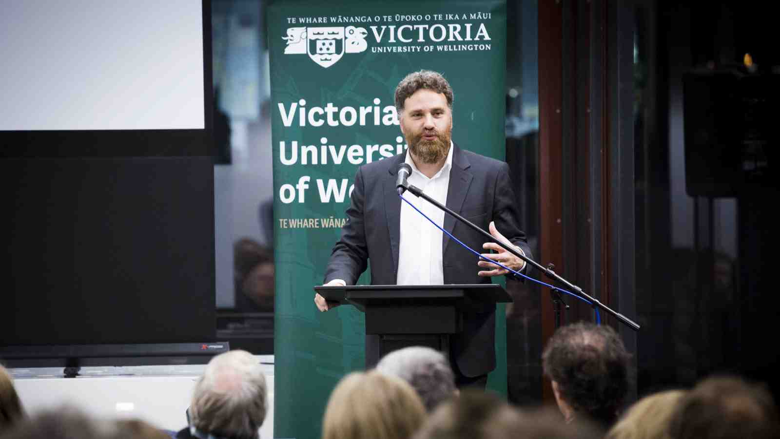 Dr Carwyn Jones delivering a lecture.