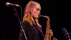 Jazz musician Louisa Williamson playing saxophone