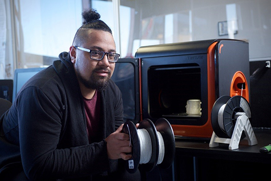 Lionel Taito-Matamua with a 3D printer