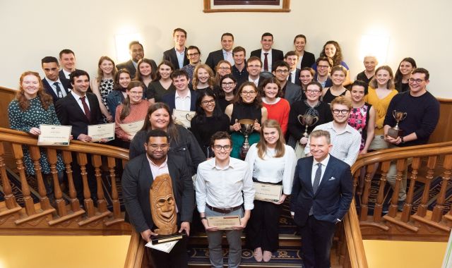 Celebrating your achievements.jpg A group stands together in the Old Government building.