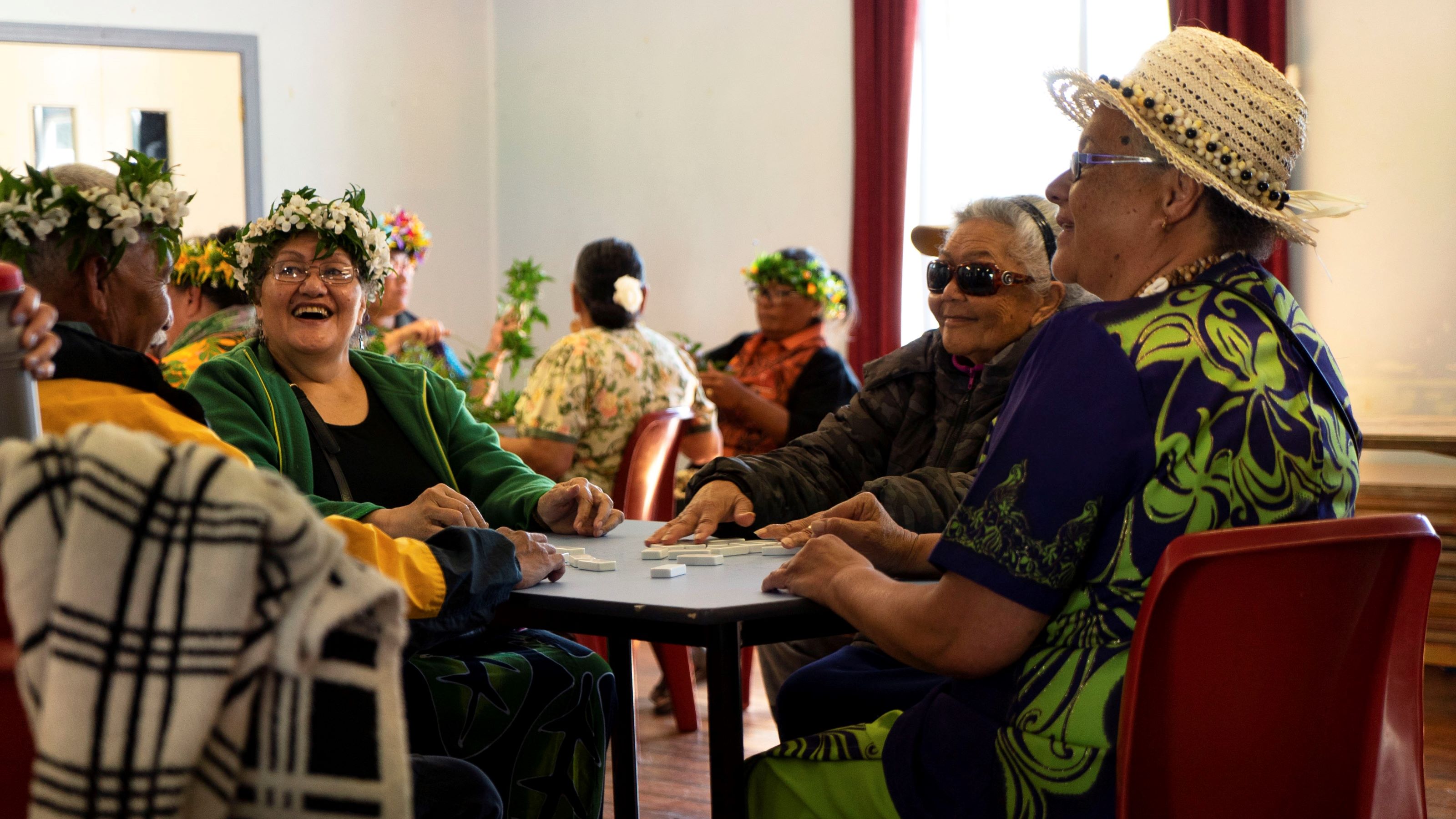 People sit around round tables