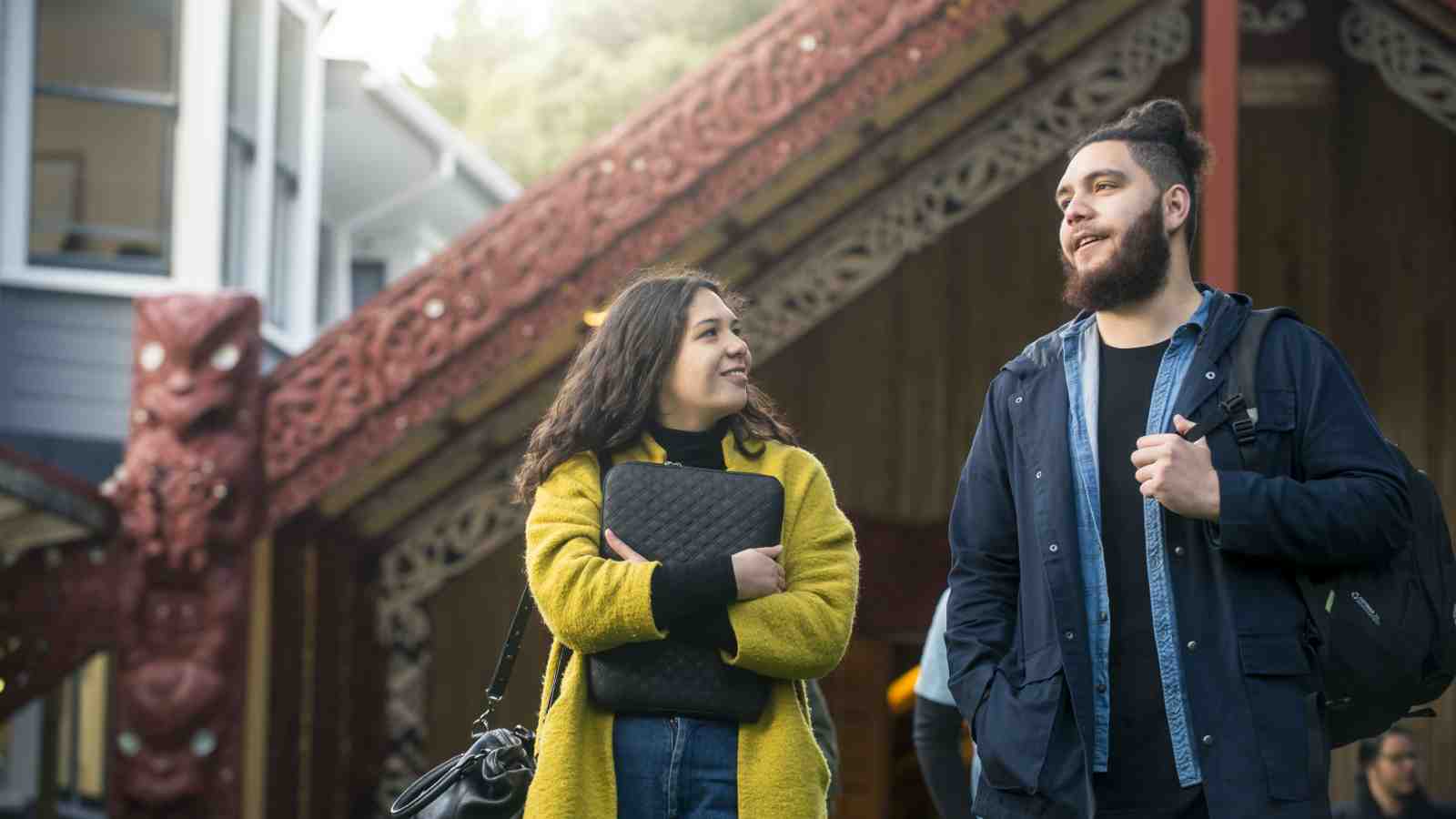 Jacob and Kayla talk in front of the Marae.