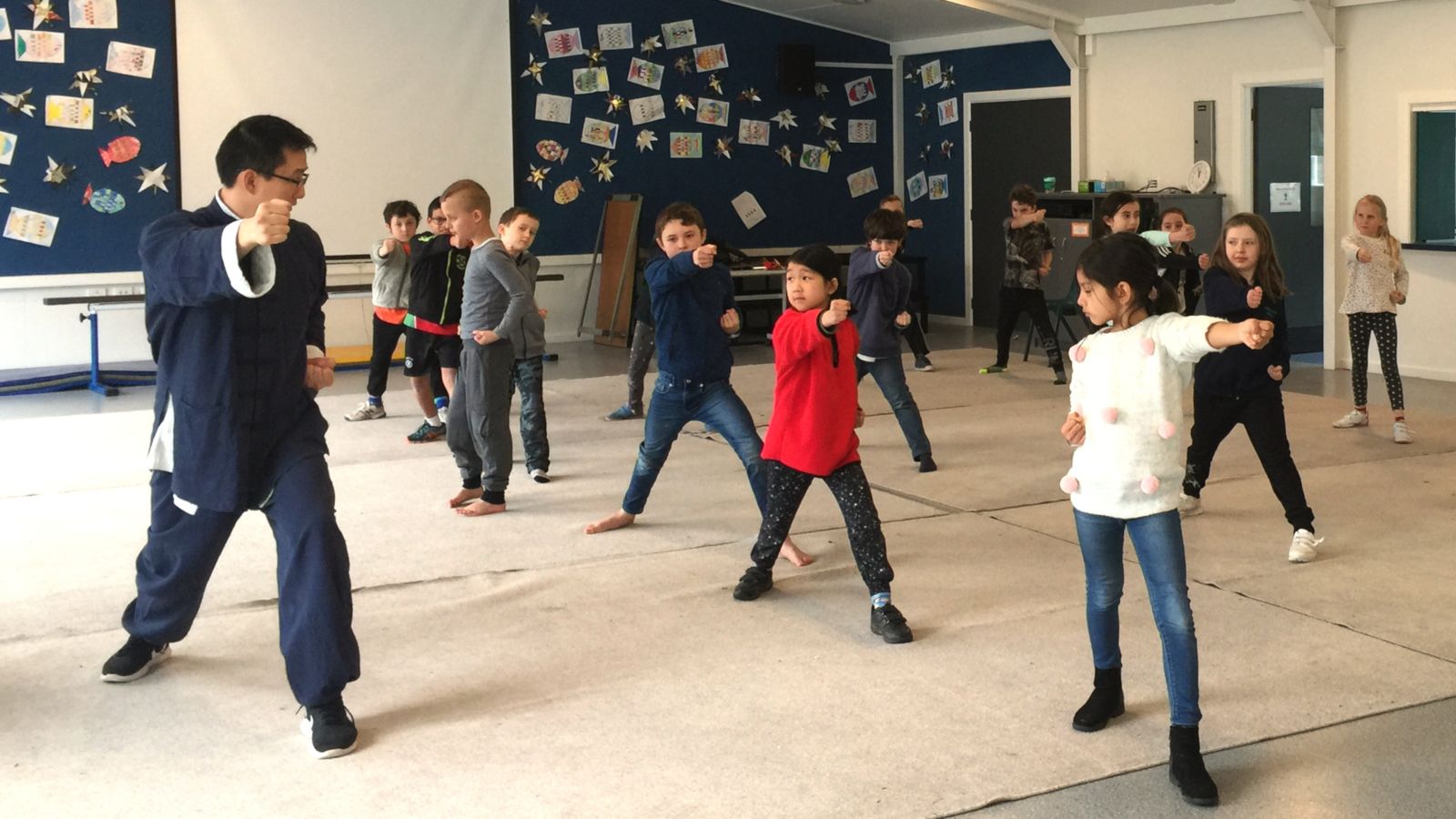 students participate in a martial arts workshop