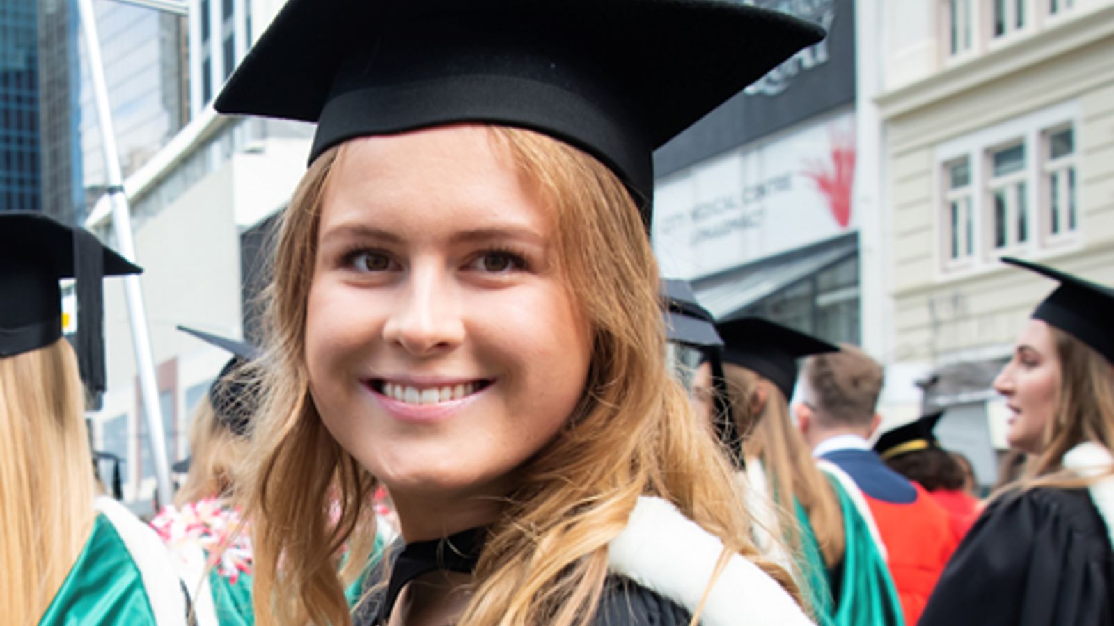 Woman smiling in graduation cap