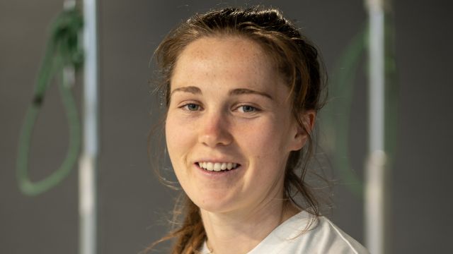 Close up of Alice smiling to the camera