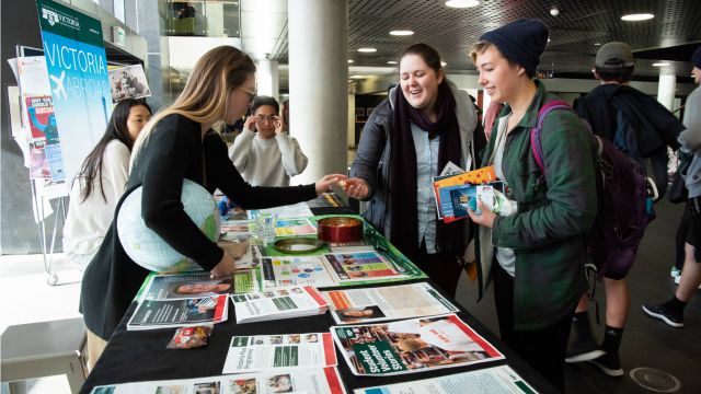 Photograph of a clubs information table in the Kelburn campus Hub