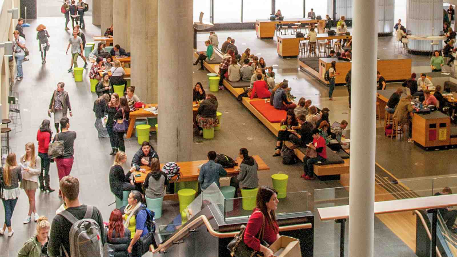 Students milling around in the Hub on Kelburn Campus