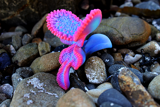 Bright pink and purple creature-like sculpture