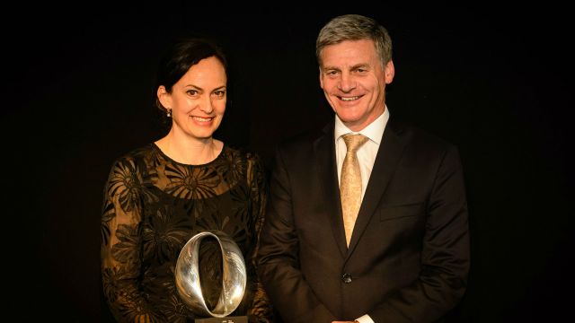 Rebecca Priestly accepting prize from Prime Minister Bill English