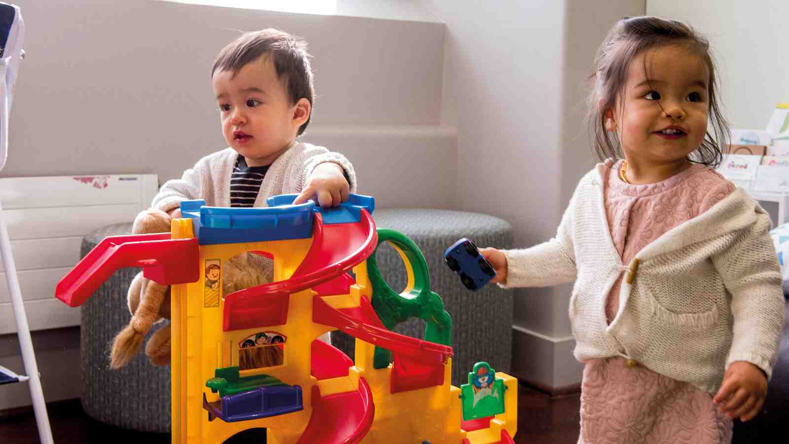 Two children playing with toys