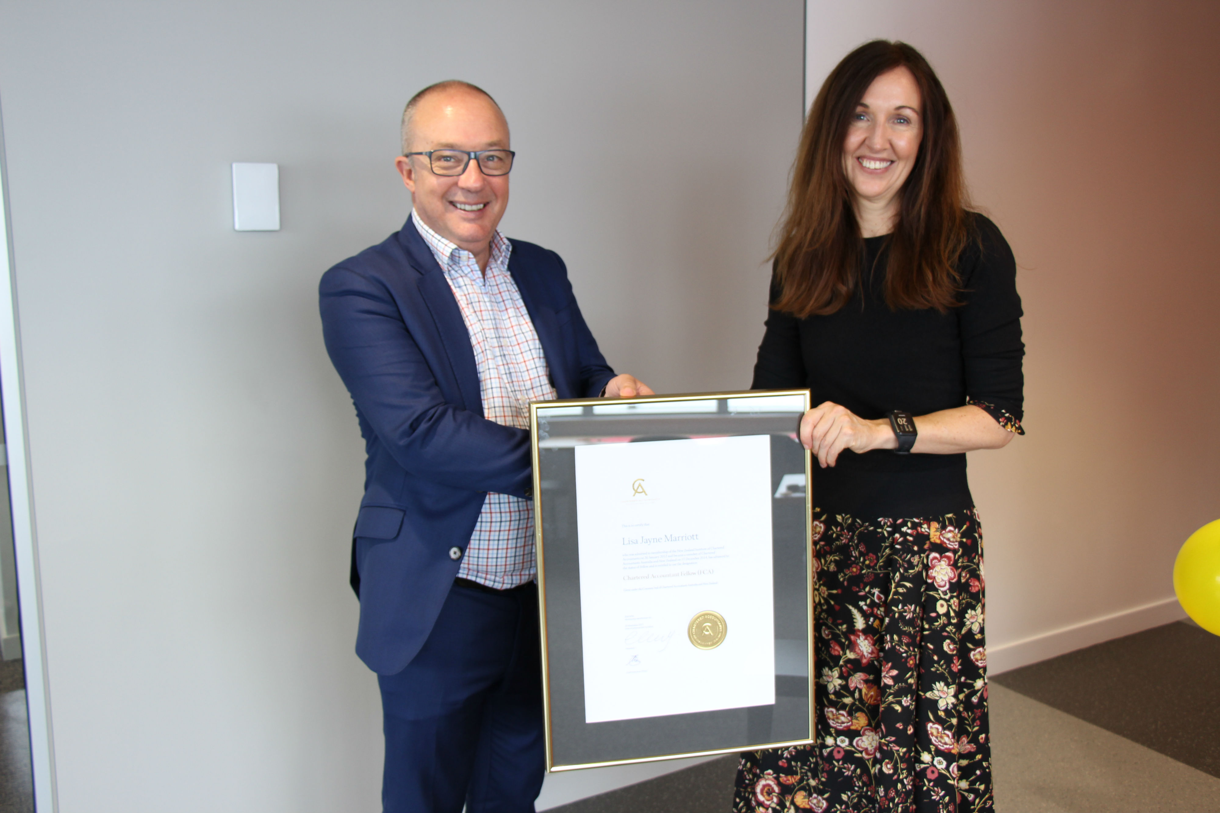 Peter Vial, New Zealand Country Head of CAANZ presenting Lisa Marriott with a fellowship award.