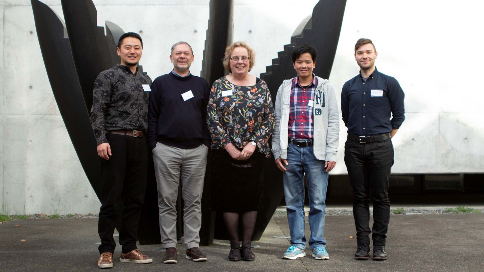 Staff and students pose for a photo at the doctoral conference.