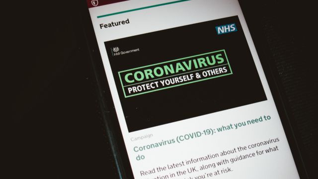 Image of a smartphone screen with a coronavirus article.