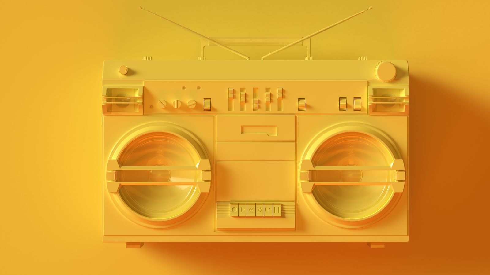 Spraypainted matte yellow 1980s cassette player on yellow background