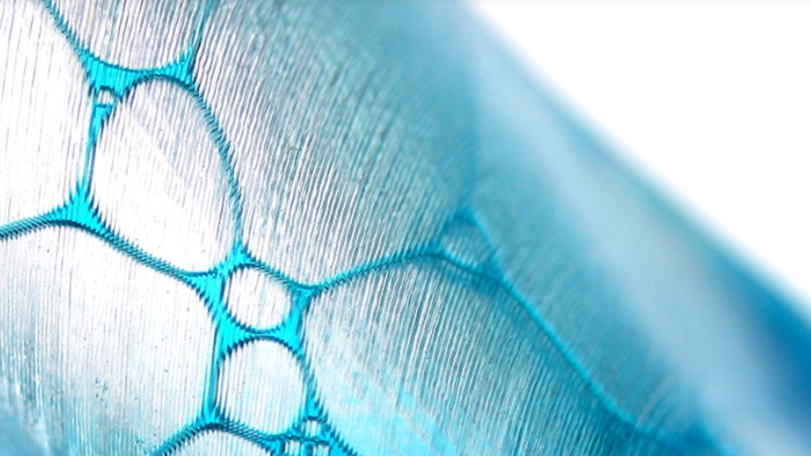 digital-biology Close up of light blue material, maybe digital 3d fabric, against white background