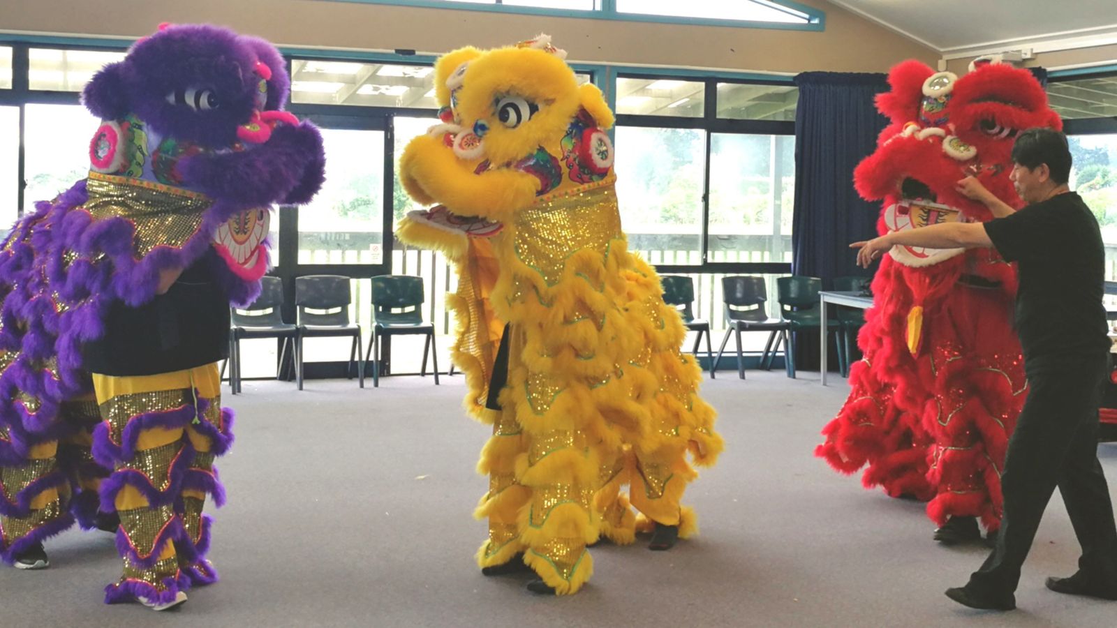 Students participate in a lion dance workshop.