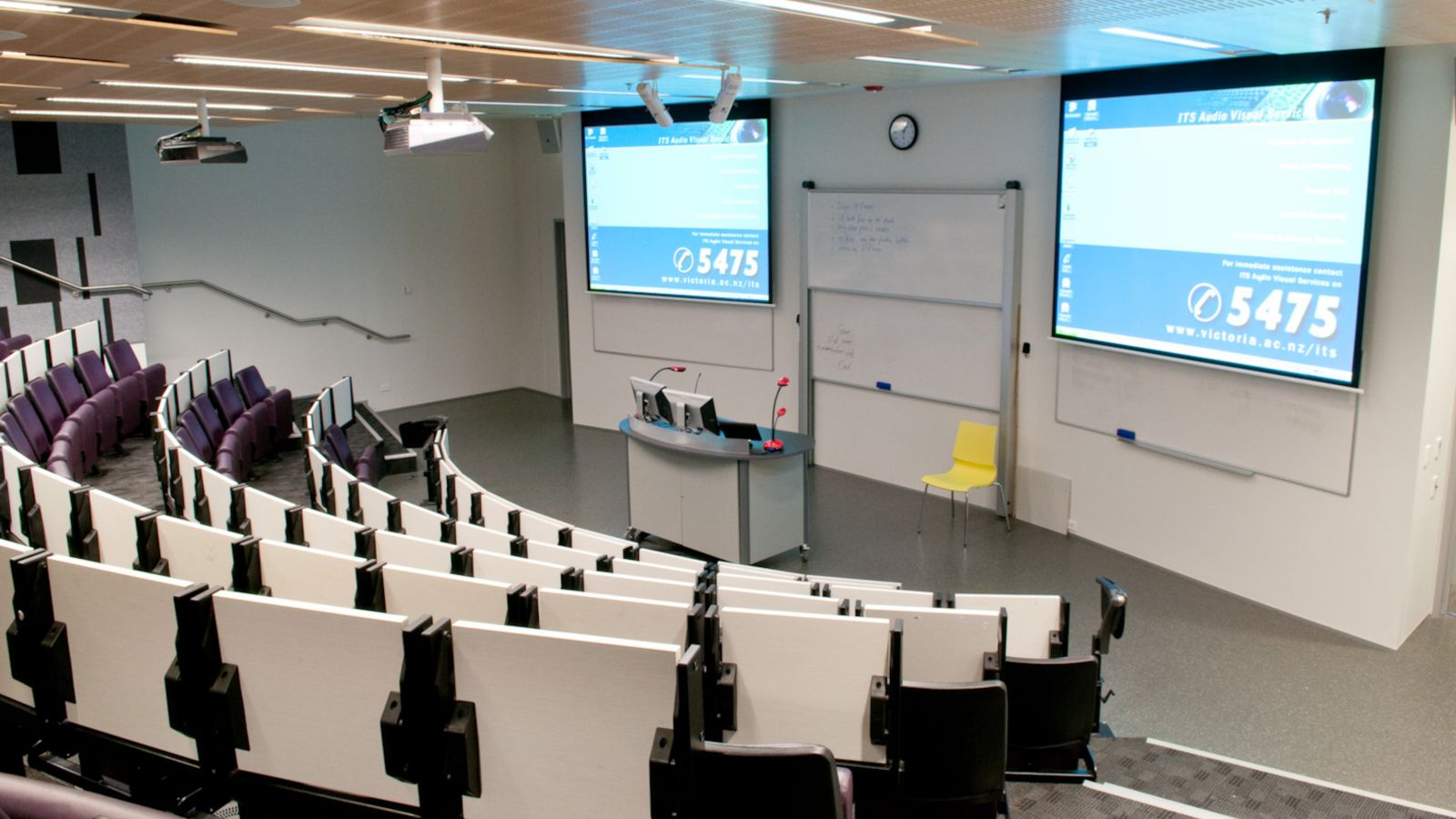 Small lecture theatre from the rear with screens visible at the front