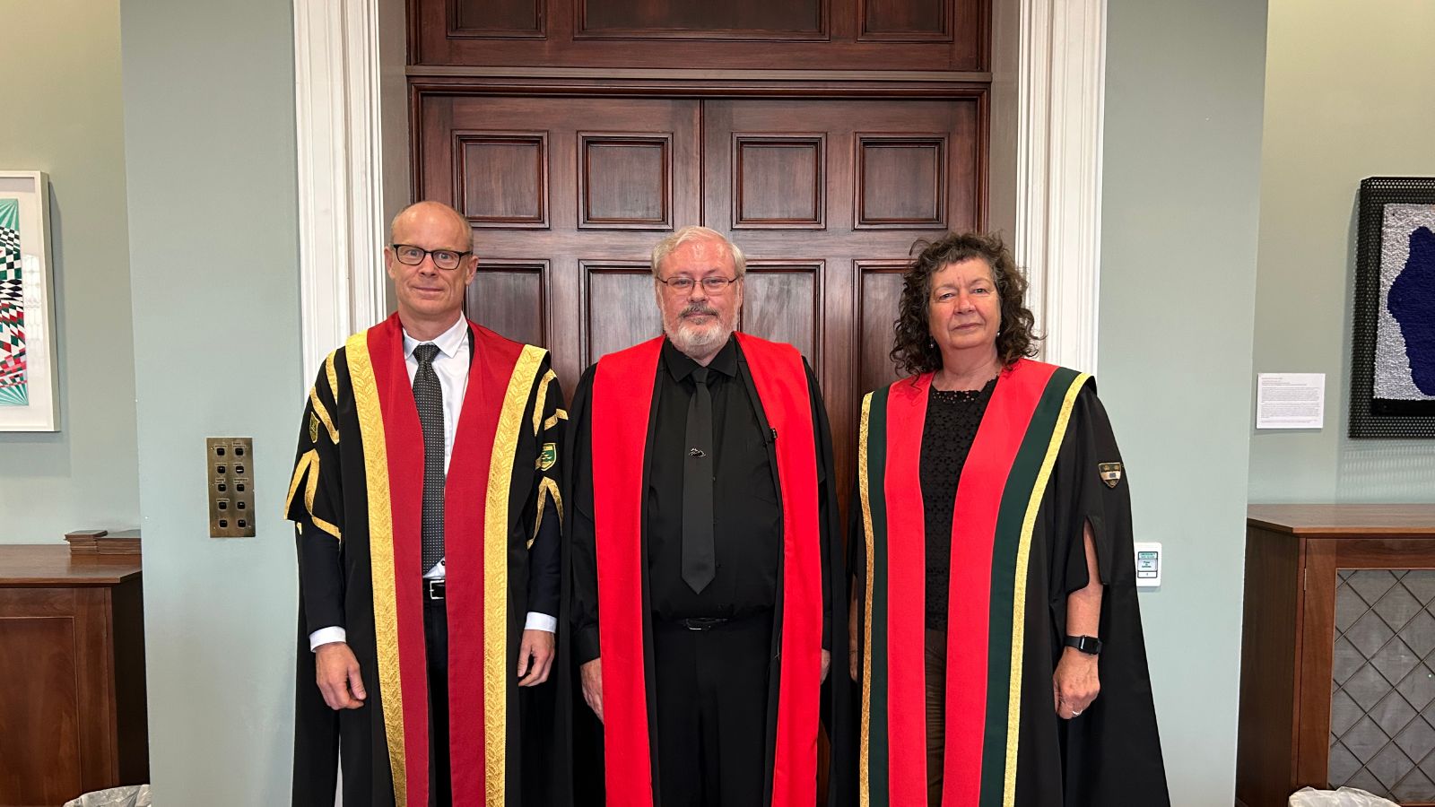 Nic Smith, Stephen Marshall and Wendy Larner standing together in academic dress