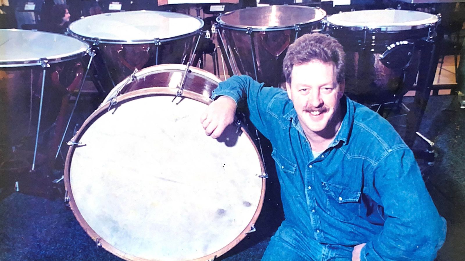 Grant Gilbert posing with NZSO percussion instruments