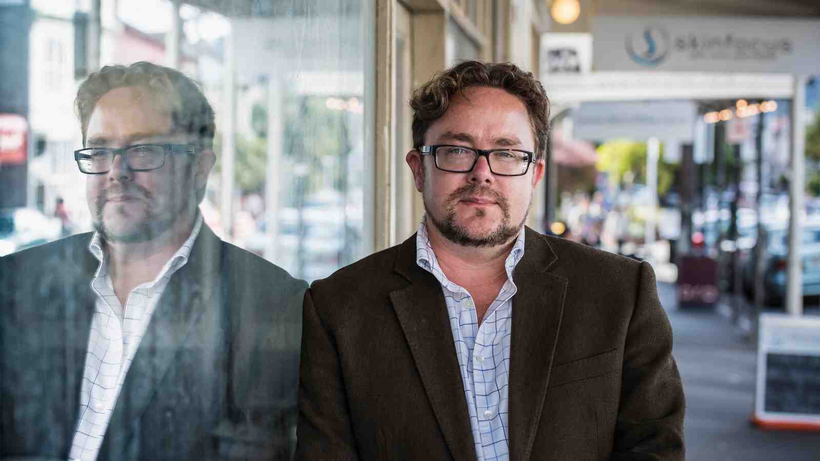 Danyl McLauchlan outside a store front in Aro Valley