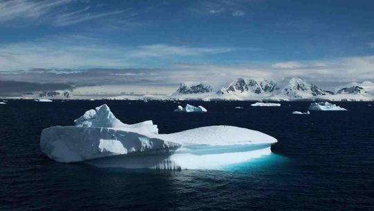 Ice berg floating in cold Antarctic waters