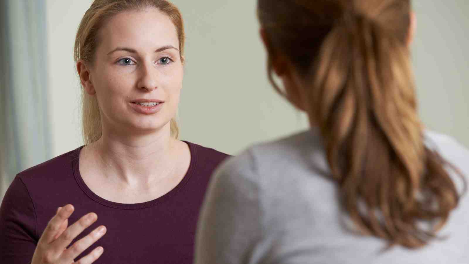 A counsellor talks with a student.