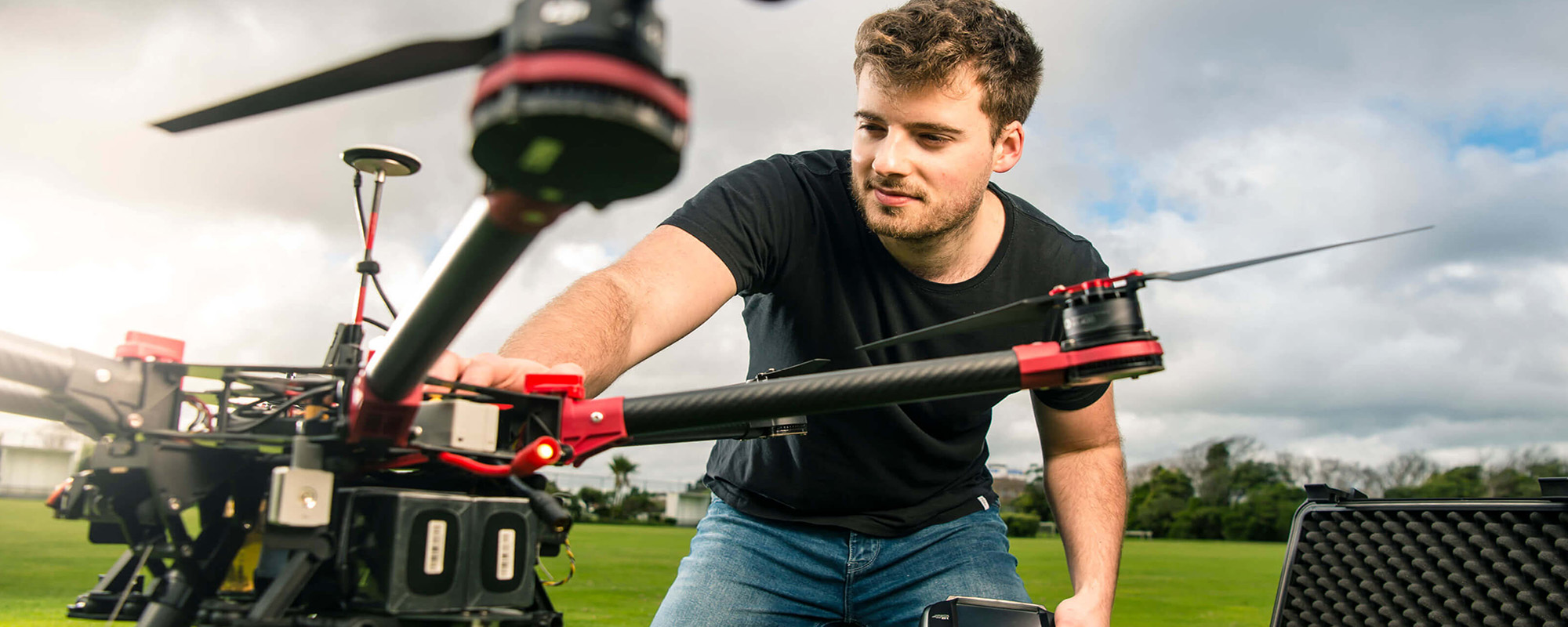 Researcher adjusting a drone.