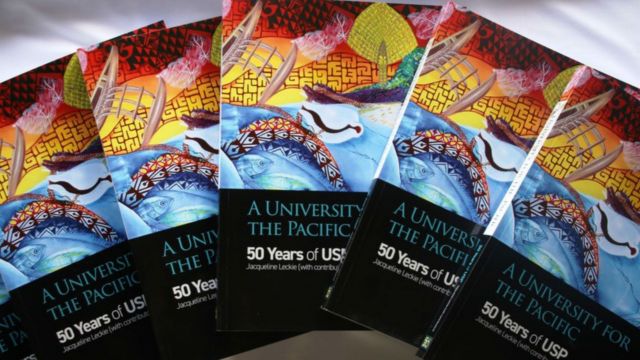 5 of the same books with titles that read, a Univeristy for the Pacific, 50 years of USP.