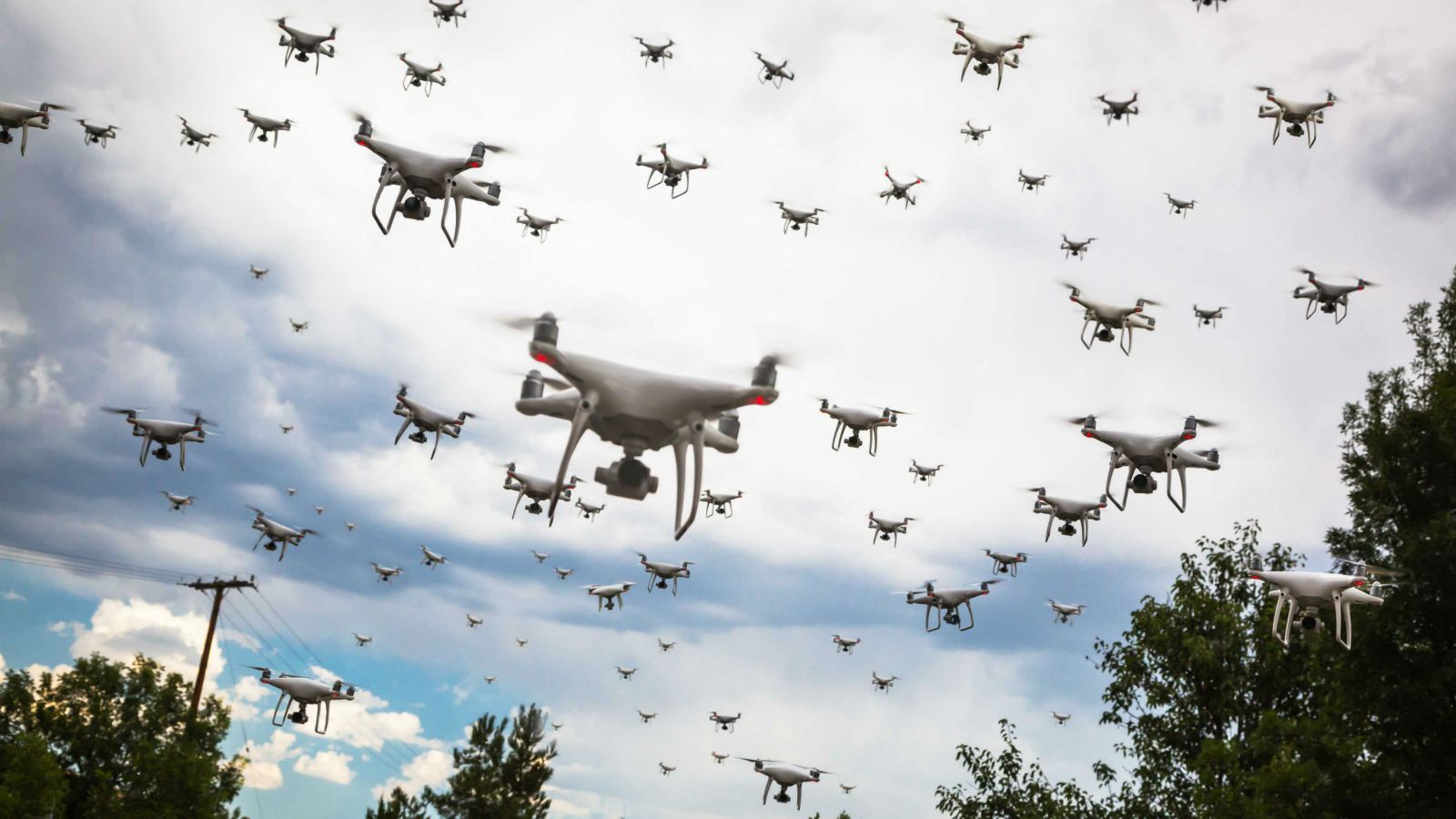 Swarm of autonomous lethal drones flying over a street
