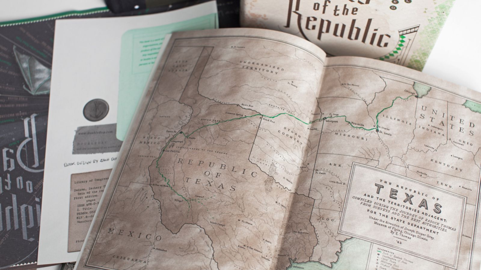 Old-looking sepia-toned map of Texas and hardback book