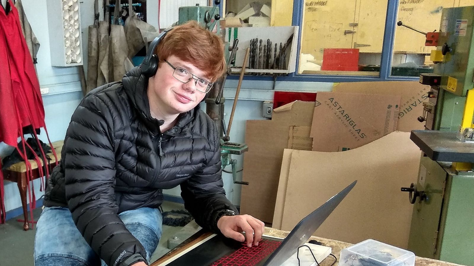 Lachlan Paulsen at his computer, in a workshop