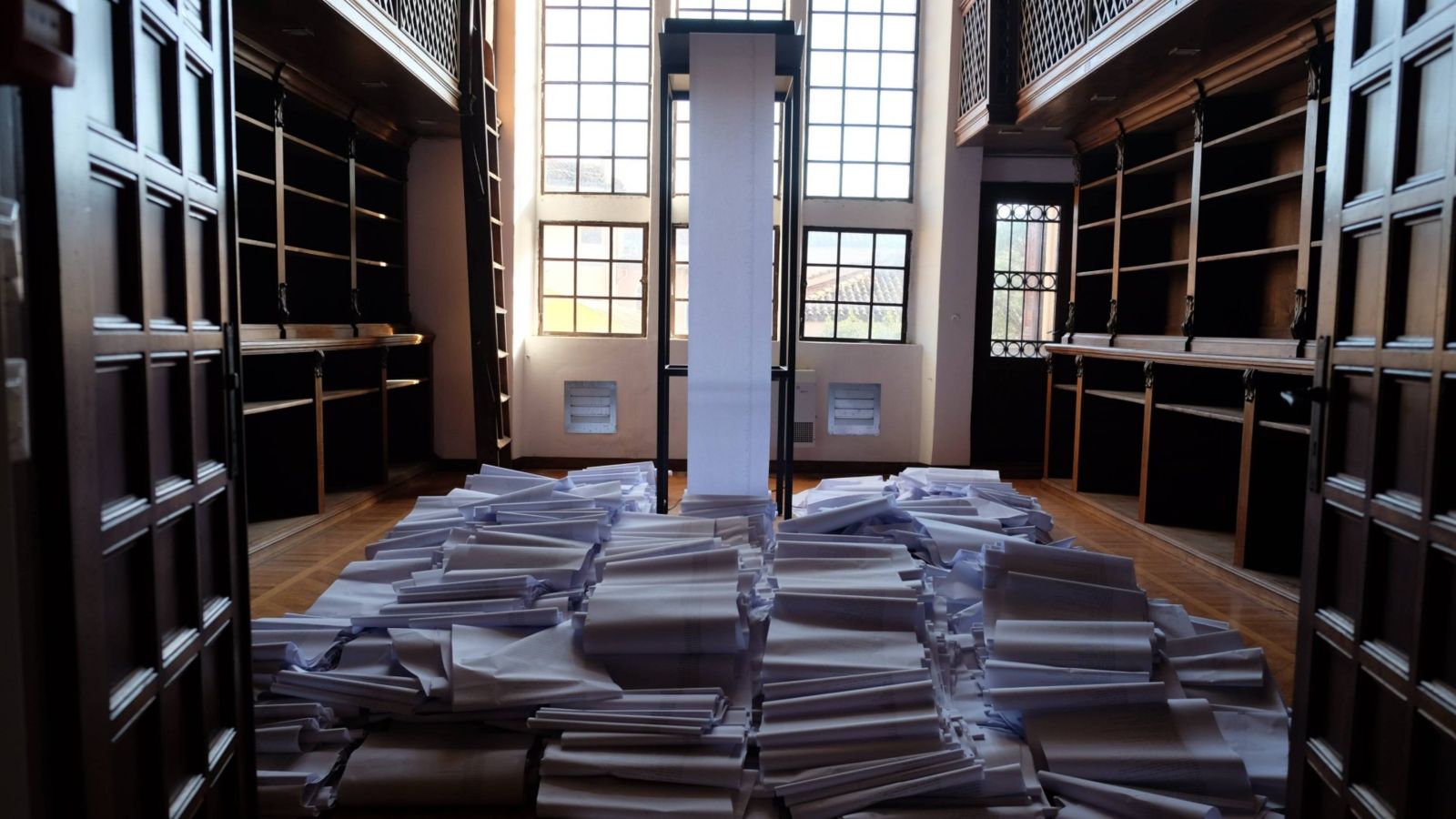 Screeds of paper fall from a tower as part of Dane Mitchell's Post Hoc exhibition at the Venice Biennale 