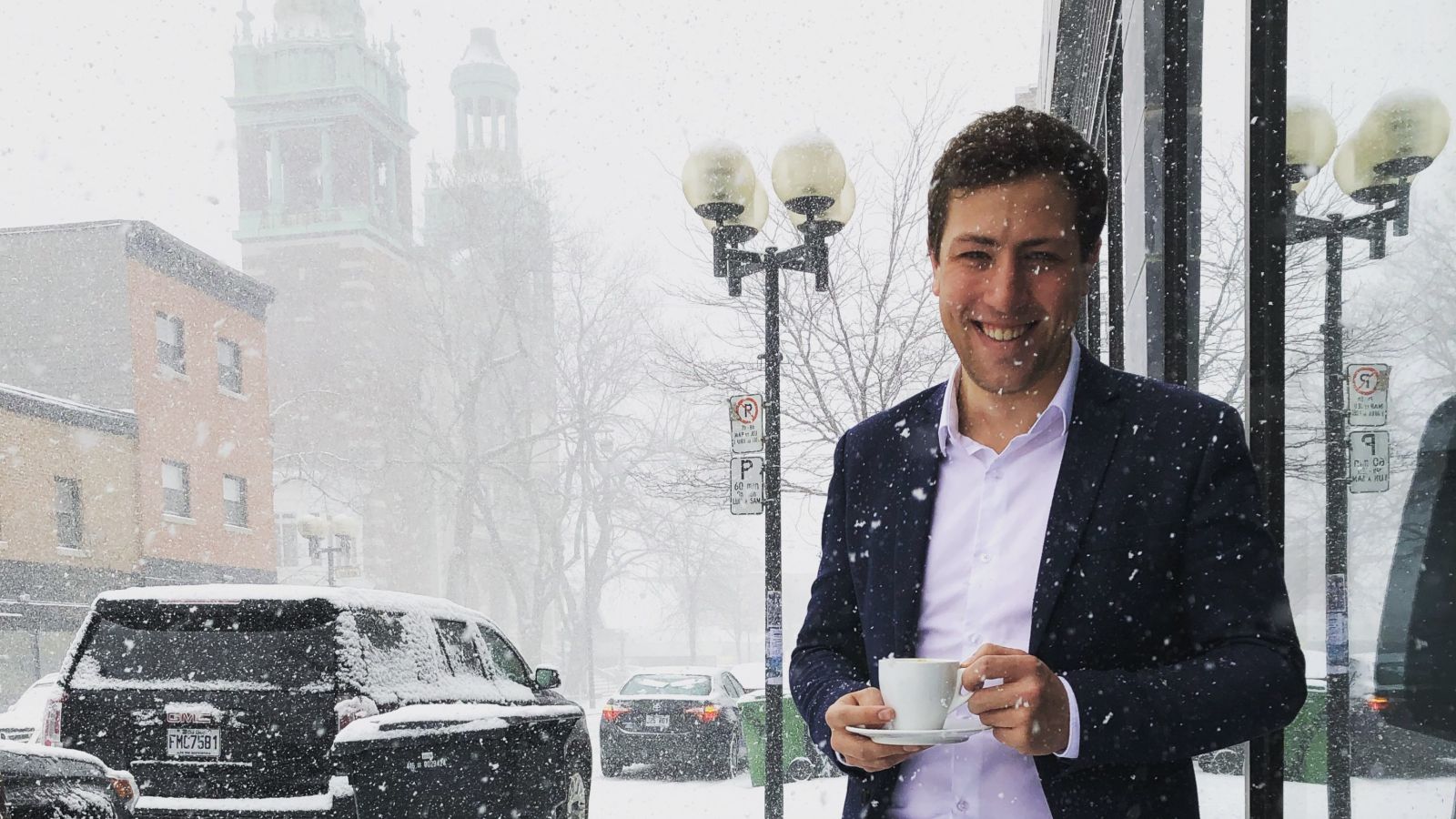 Hamish McConnochie Organizational Design Consultant Deloitte Canada in Montréal in the snow with a cup of coffee