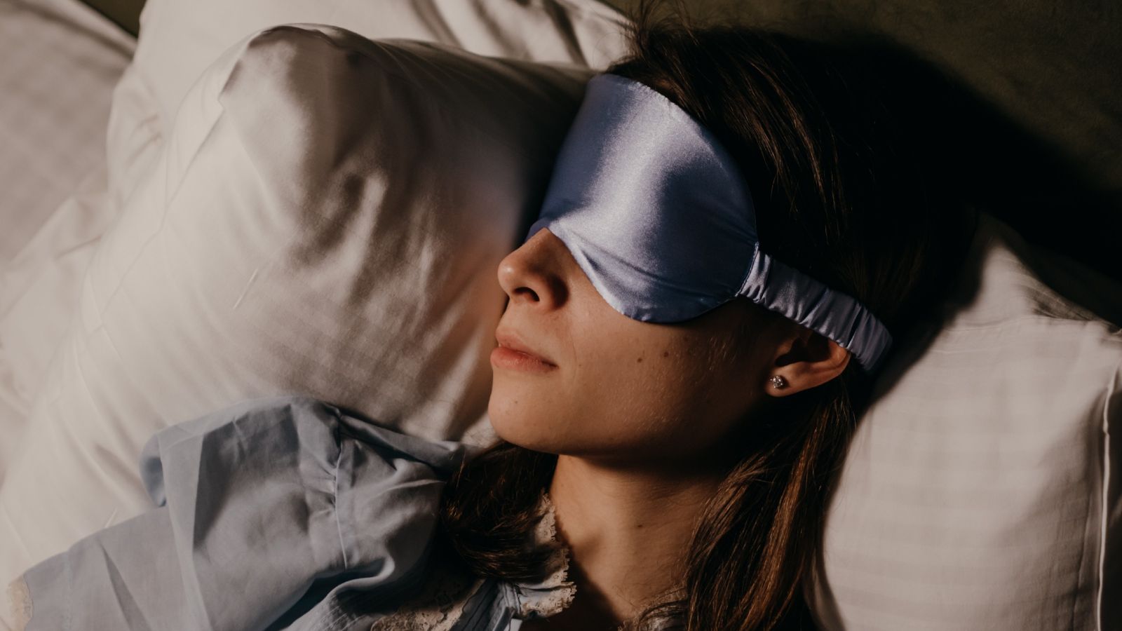 Woman sleeping while wearing eyemask