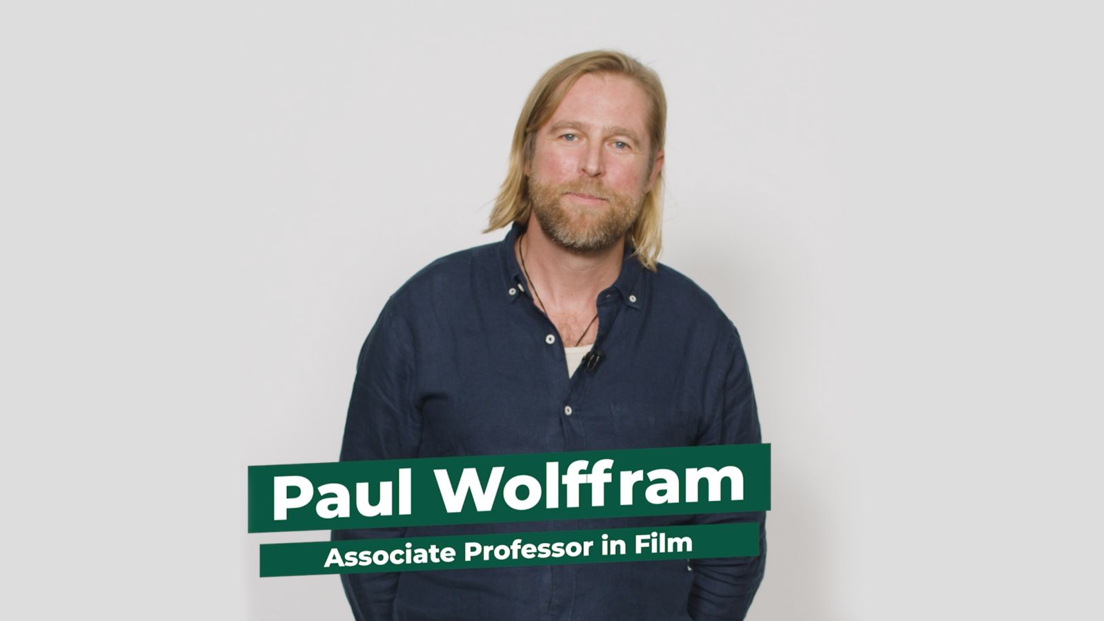Associate Professor Paul Wolffram stands facing the camera against a white background