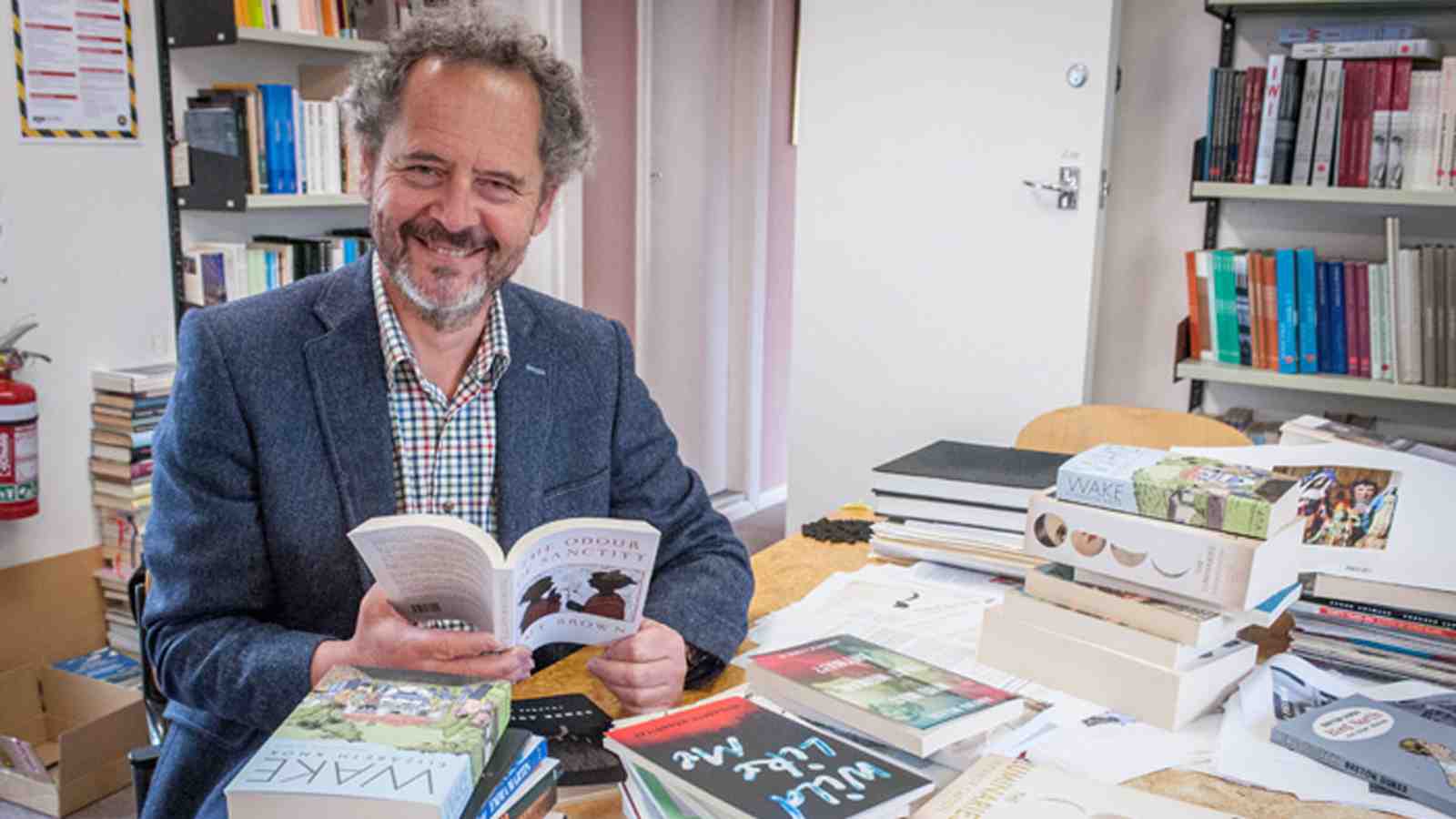 Fergus Barrowman reading a book.