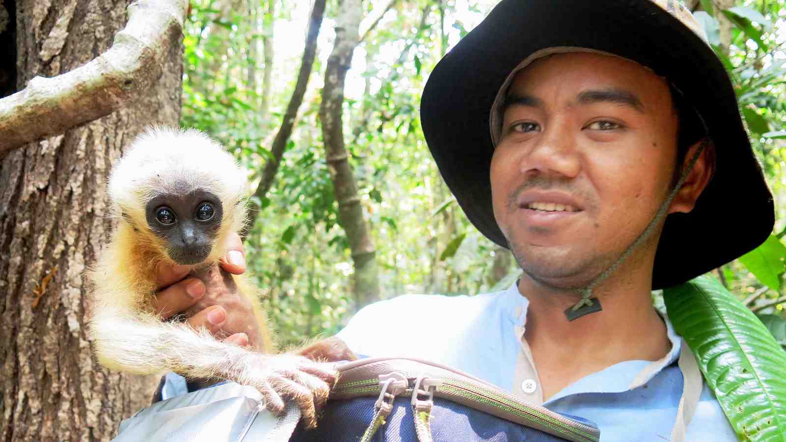 Naven Hon and an orphaned gibbon.