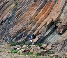 Student Denise Tang looking at layers of rock