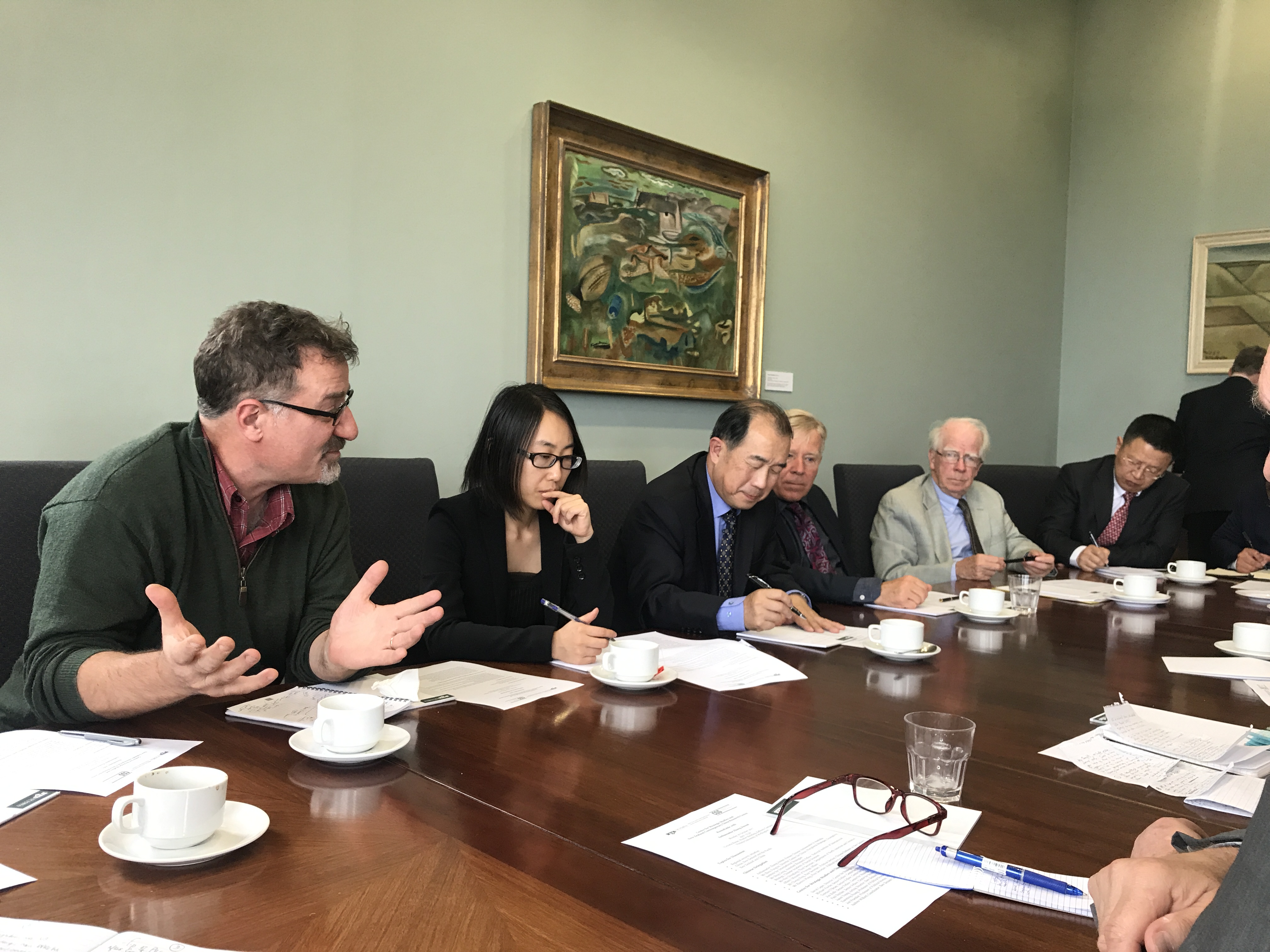 Portrait of Delegation from China in Victoria Room seated at boardroom table