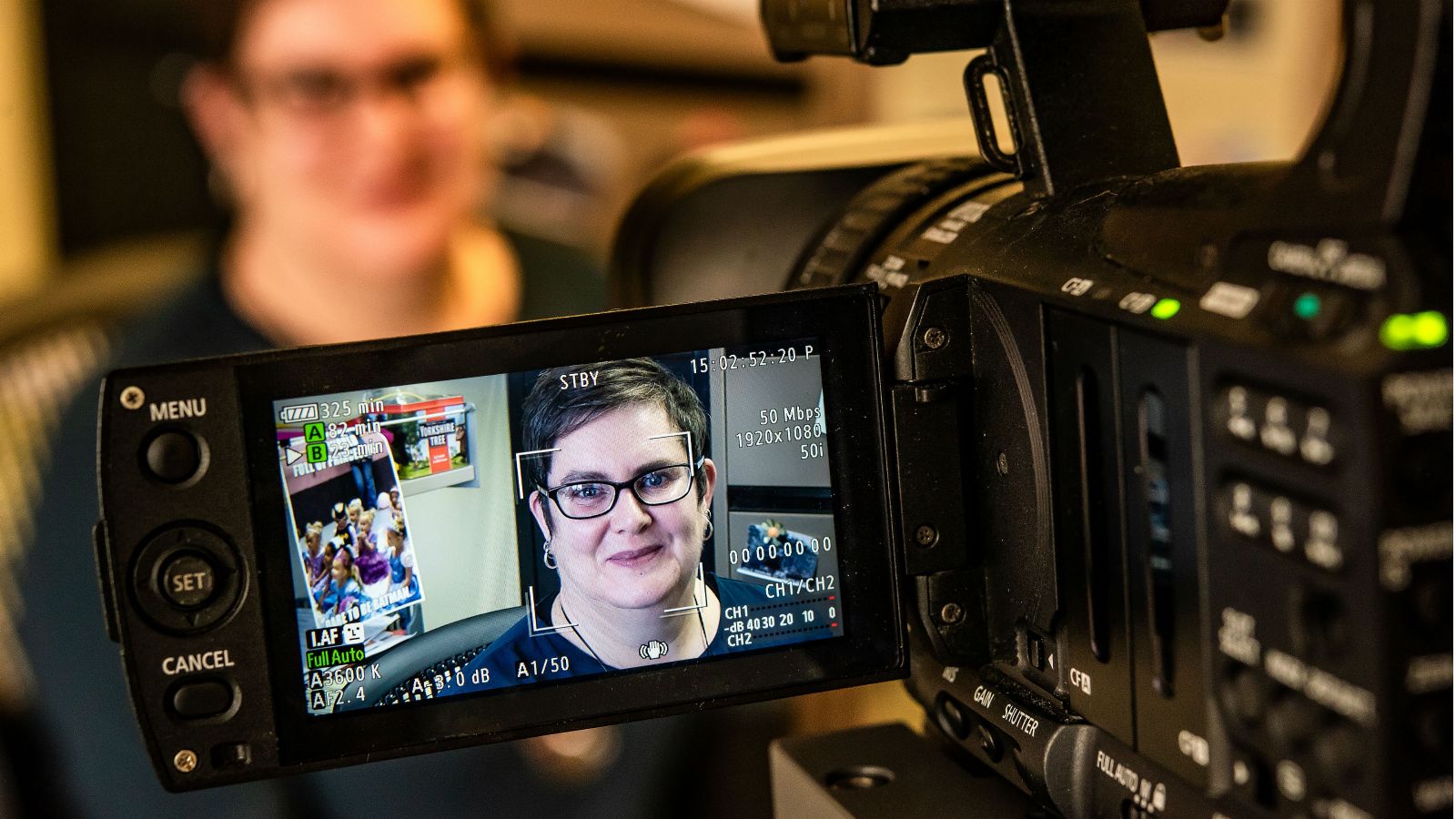 Dr Fiona Hutton captured on the LCD screen of a video camera.